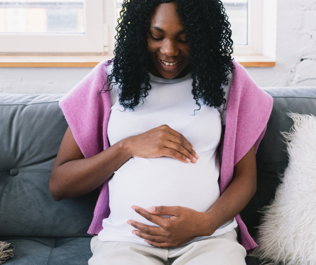 Expectant mother on couch