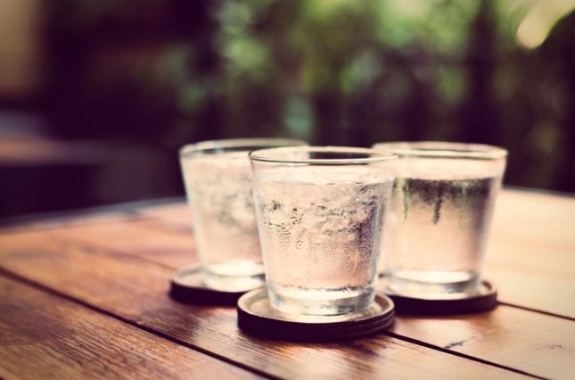 Three glasses of water on a table. Photo credit:  bunyarit / Shutterstock