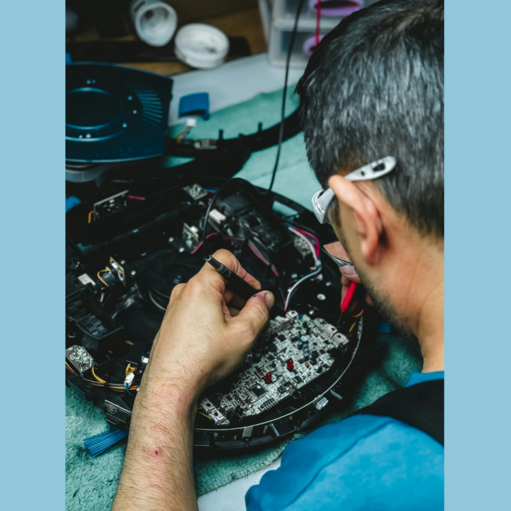 A man repairing electronics