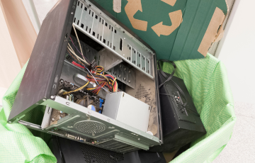 Scrapped computer in a recycling bin
